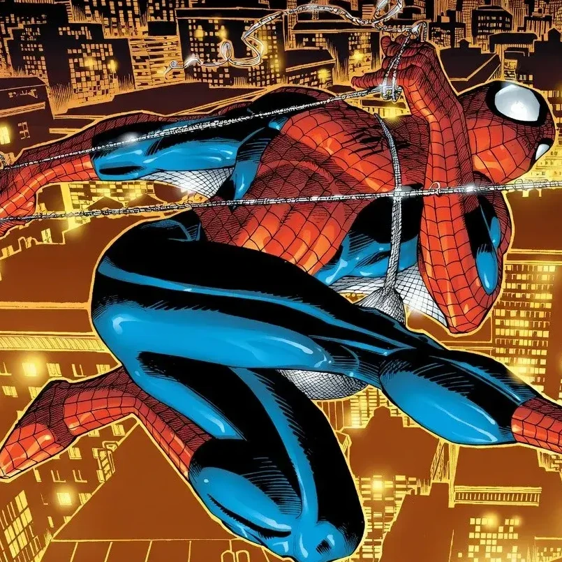 Spider-Man swinging over a lit city at night.